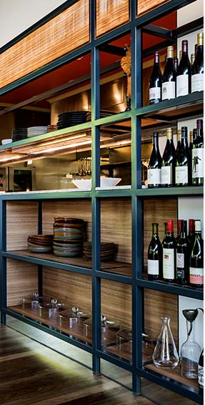 plates and wine on the shelf