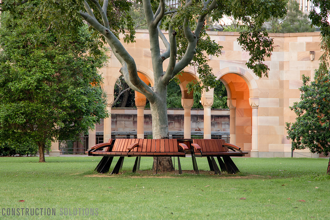 benches in a circle around a tree at uq great court